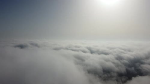 High Above the Thick Fog Like Beautiful Ocean of Clouds at Sunrise
