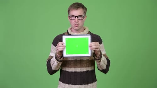 Young Adult Holding Tablet with Chroma Key Display