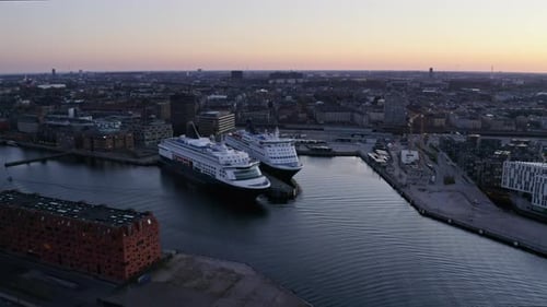 Orange Sky and Cruise Ships Docked at Copenhagen Port in Denmark