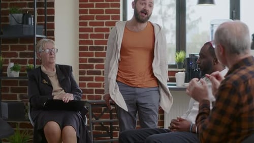 Man Speaking at Group Therapy Session