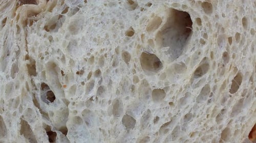 Extreme Close-Up of Porous Slice of White Bread