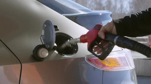 Putting Nozzle into Gas Tank