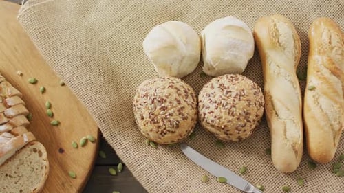 Assorted Bread on Burlap and Wooden Cutting Board