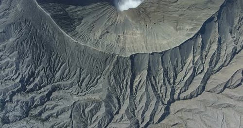 Aerial Footage. Crater with Active Volcano Smoke in Bali, Indonesia. Travel Concept. Asian Scenic