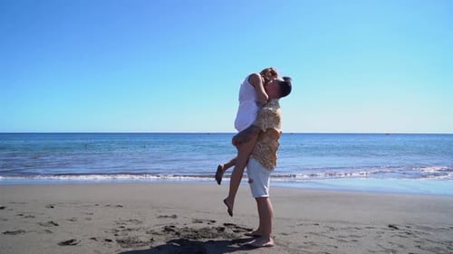 Happy Young Couple at the Sea Vacations
