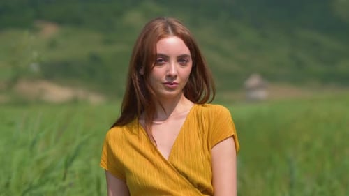 Woman Portrait in Field on a Sunny Day