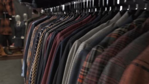 Row of Men Suit Jackets on Hangers in Different Colors. Shop Jacket Men Series, Business Hanger