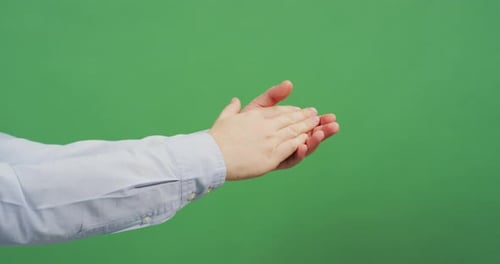 Side view of hands clapping