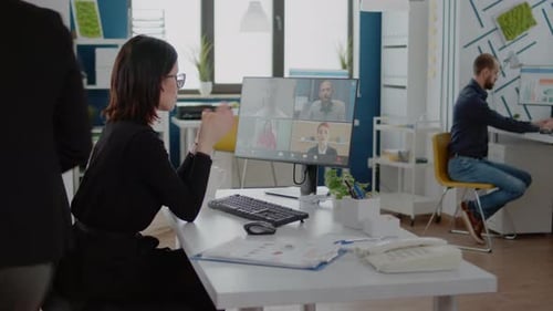 Woman Attends a Video Conference in a Modern Office