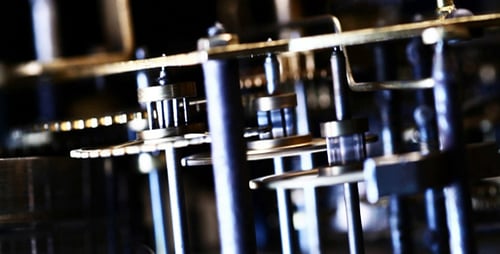 Clock Gears Turning Inside Close Up View