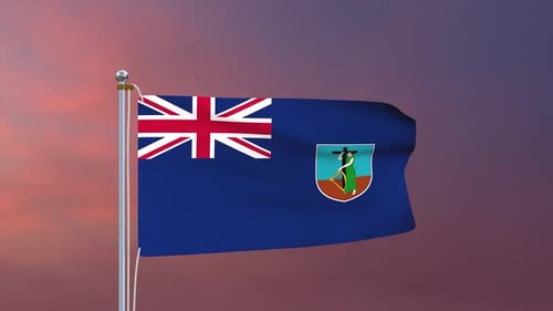Montserrat National Flag Waving on Flagpole Against Sunset Sky