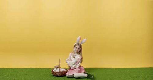 Child Cuddles Easter Bunny with Bunnies in Basket