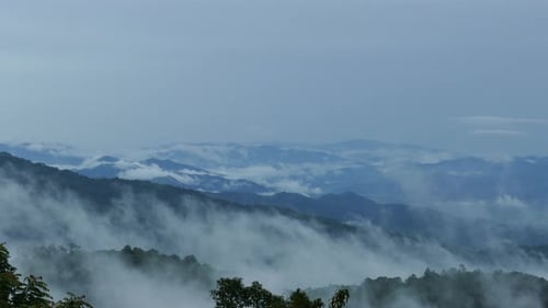 4K Beautiful mountains filled with fog.