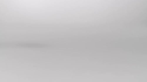 Two Eggs Crashing on White Background, Studio Shot