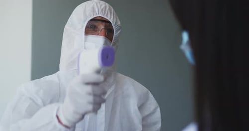 Temperature Check with Protective Suit and Mask