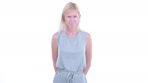 Woman Giving Thumbs Down Gesture in Studio