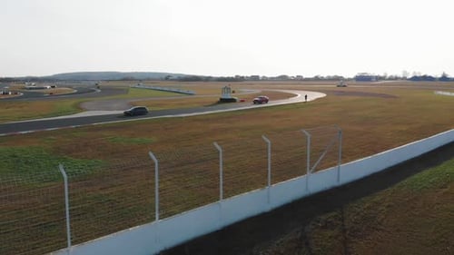 Cars Driving on Racetrack Aerial View