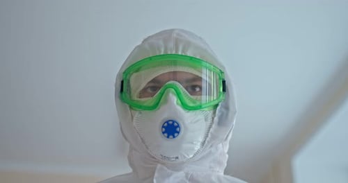 Health Worker in Full Protective Gear Close Up