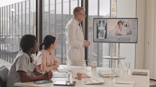 Multiethnic Doctors Video Conferencing in Radiology Clinic