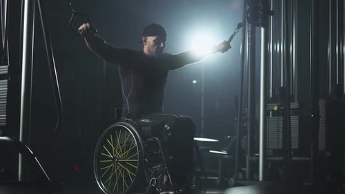 Man in Wheelchair Works Out on Cable Machine