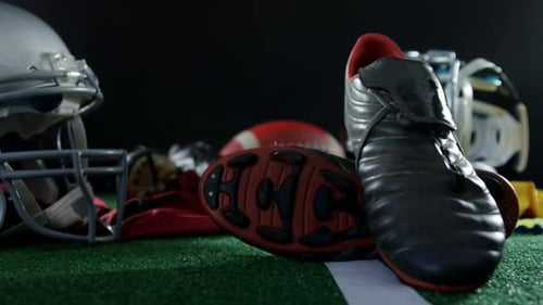 American Football Gear Displayed on a Field