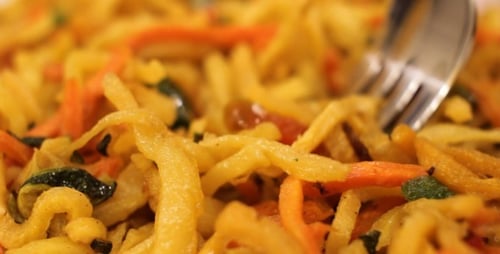 Close-Up of Noodles and Vegetables with Fork