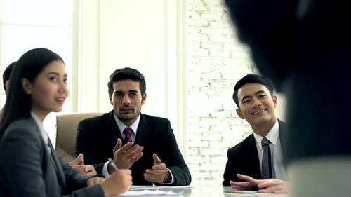 Corporate Team Celebrates Success in Modern Office
