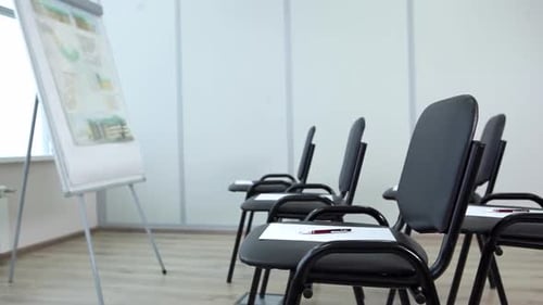 Empty Conference Room with Chairs and Whiteboard
