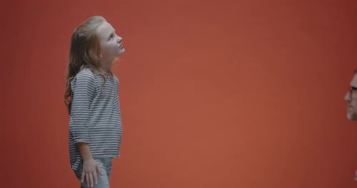 Smiling Child Interacting With Caring Doctor in Clinic