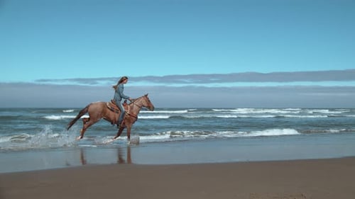Super slow motion shot of woman riding horses at beach, Oregon, shot on Phantom Flex 4K