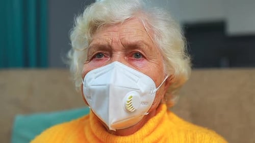 Senior Woman Wearing a Face Mask Indoors