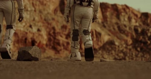 Astronauts Walking on a Desert Planet Surface