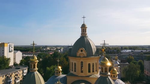 Crosses on the Domes of a Christian Church on a Background of Sunny Sky