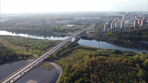 Cars Drive Over the Bridge Shooting From a Bird's Eye View