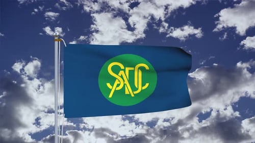 Waving Flag with Custom Logo Against Cloudy Sky