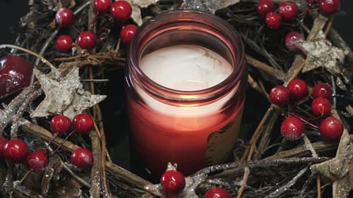 Festive Candlelight in Holiday Wreath