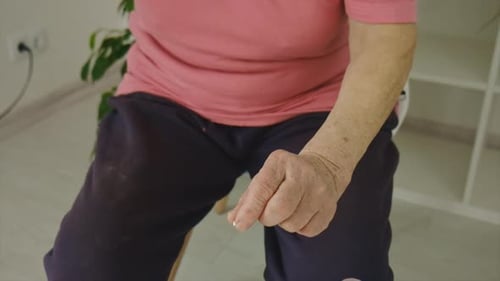 Senior Woman Taking Medication in Her Home