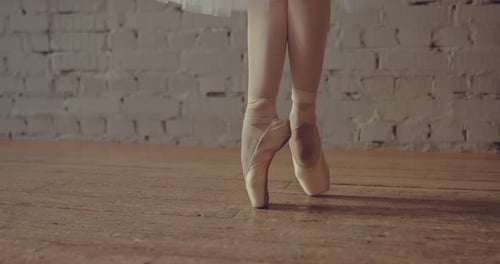 Ballerina Makes a Turn Around Herself in Pointe