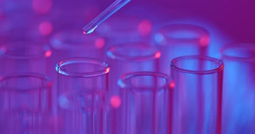 Liquid Drops into Test Tube in Laboratory