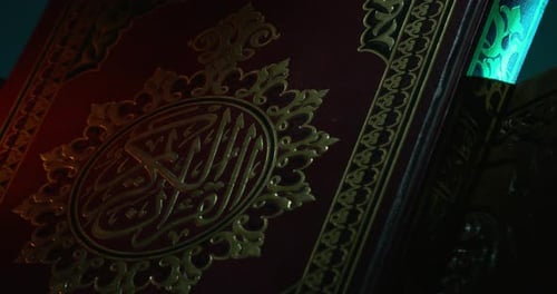 Holy Quran Cover On Book Rest With Prayer Beads