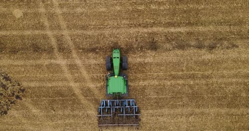 Tractor Plows The Field For The Winter