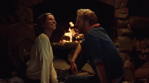 Loving Couple Enjoying Cozy Fireplace Moment