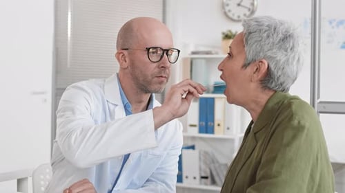 Doctor Examines Patient in Bright Medical Office