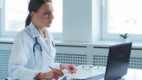 Professional medical doctors working in hospital office making research.