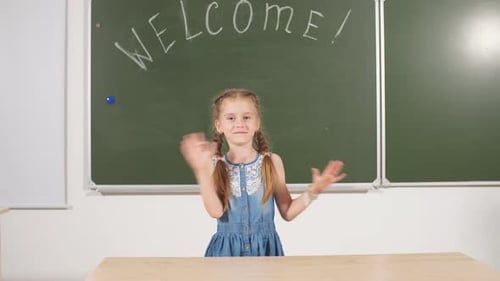 Back To School Concept. Schoolgirl Chalkboard in Classroom.