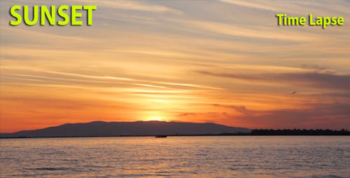 Brilliant Sunset Over Ocean with Distant Mountains