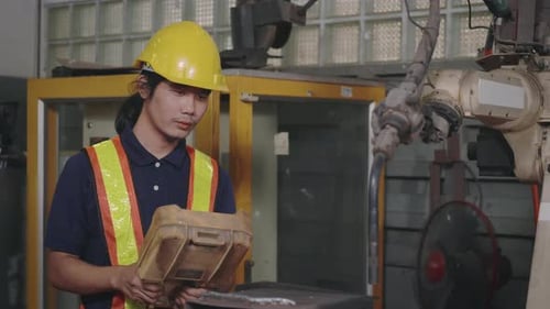 engineering man check and control welding robotics automatic arms machine for automated programming