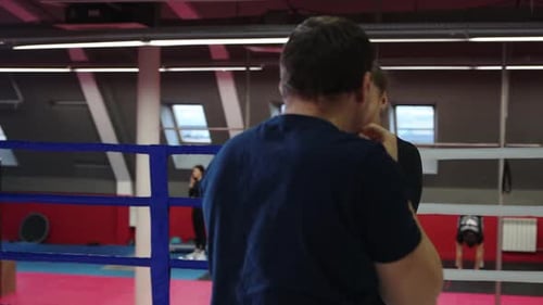 Gym Training Young Woman Training Her Boxing on the Ring with Trainer Training Defensive Technics