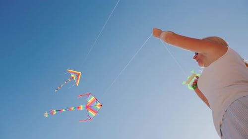Active Rest on the Beach - Woman Playing with Kite, Low Angle Shot