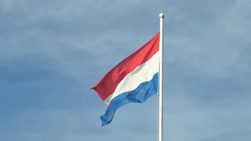Flag Waving Against a Blue Sky